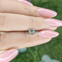0.55 Ct. Bluish Green Sapphire from Madagascar Life Style