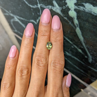 2.02 Ct. Yellowish Green Sapphire from Madagascar Life Style
