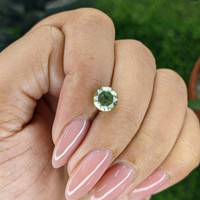 2.18 Ct. Yellowish Green Sapphire from Madagascar Life Style