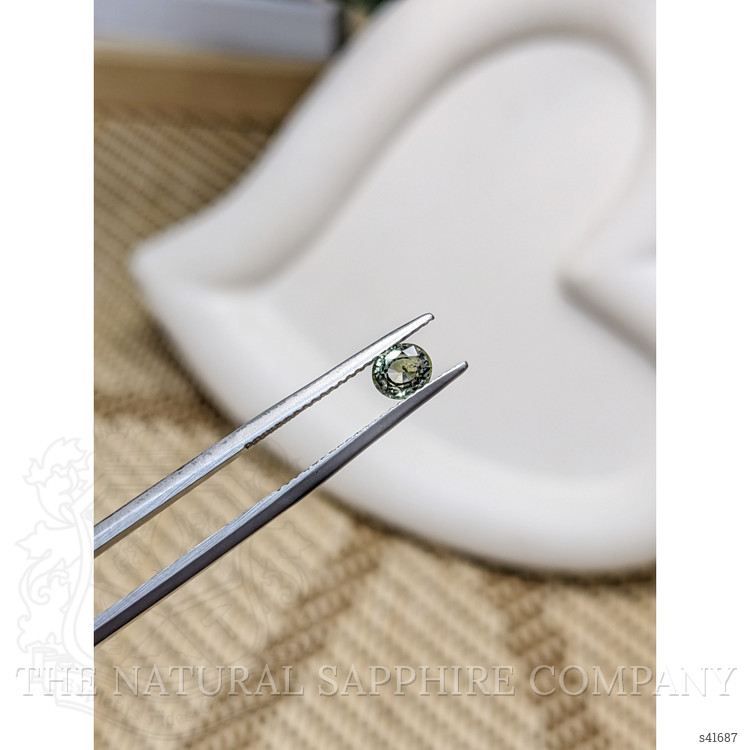 0.59 Ct. Brownish Green Sapphire from Ceylon (Sri Lanka)