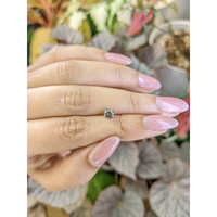 0.59 Ct. Brownish Green Sapphire from Ceylon (Sri Lanka) Life Style