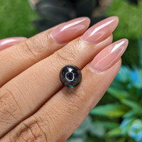 3.56 Ct. Bluish Green Cabochon Sapphire from Madagascar Life Style