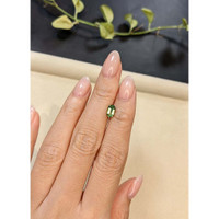 0.99 Ct. Yellowish Green Sapphire from Madagascar Life Style