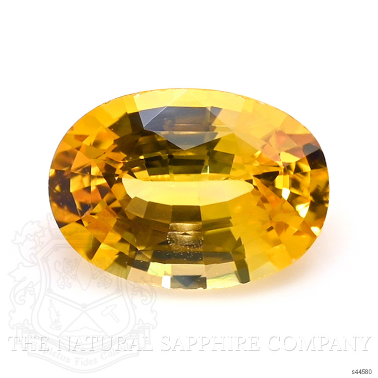 0.73 Ct. Orangish Yellow Sapphire from Ceylon (Sri Lanka)