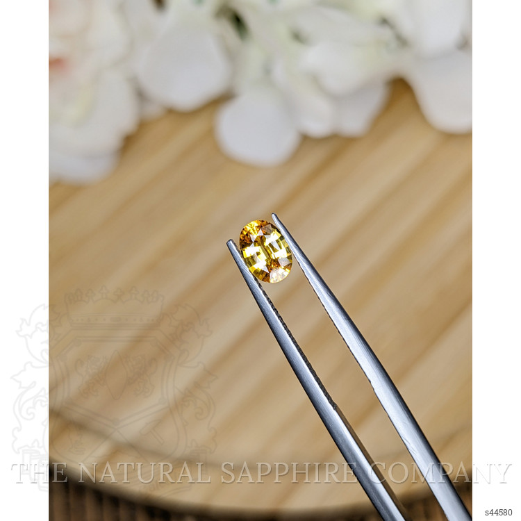 0.73 Ct. Orangish Yellow Sapphire from Ceylon (Sri Lanka)