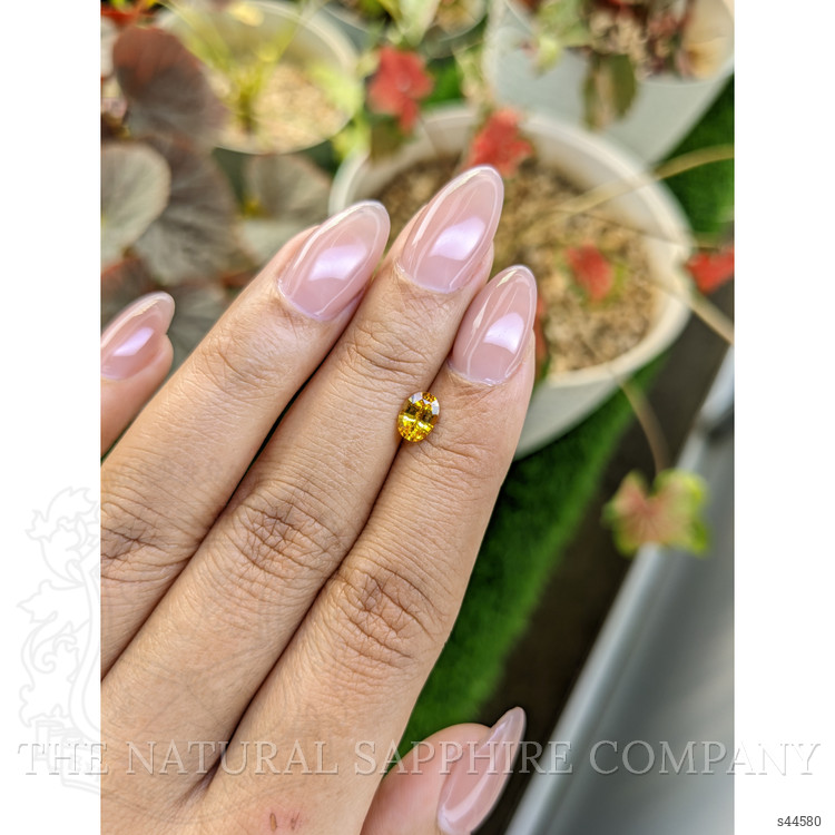 0.73 Ct. Orangish Yellow Sapphire from Ceylon (Sri Lanka)