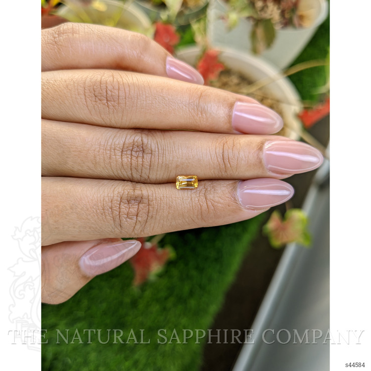 0.64 Ct. Orangish Yellow Sapphire from Ceylon (Sri Lanka)