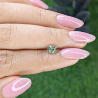 0.97 Ct. Yellowish Green Sapphire from Madagascar Life Style