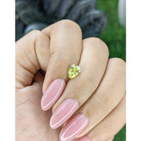 0.99 Ct. Greenish Yellow Sapphire from Madagascar Life Style