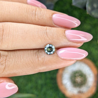 0.90 Ct. Bluish Green Sapphire from Madagascar Life Style