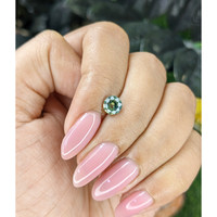 0.90 Ct. Bluish Green Sapphire from Madagascar Life Style