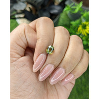 1.73 Ct. Yellowish Green Sapphire from Tanzania Life Style