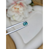 0.72 Ct. Bluish Green Sapphire from Madagascar Life Style