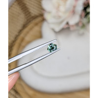 0.56 Ct. Bluish Green Sapphire from Madagascar Life Style