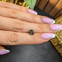 1.57 Ct. Yellowish Green Sapphire from Madagascar Life Style