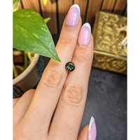 1.57 Ct. Yellowish Green Sapphire from Madagascar Life Style