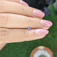0.13 Ct. Purplish Blue Sapphire from Tanzania Life Style