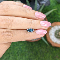 0.90 Ct. Greenish Blue Sapphire from Madagascar Life Style