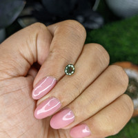 1.01 Ct. Yellowish Green Sapphire from Madagascar Life Style