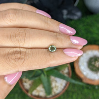 1.01 Ct. Yellowish Green Sapphire from Madagascar Life Style