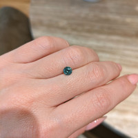 0.72 Ct. Bluish Green Sapphire from Madagascar Life Style