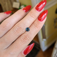0.77 Ct. Bluish Green Sapphire from Madagascar Life Style