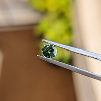 0.60 Ct. Bluish Green Sapphire from Madagascar Life Style