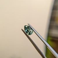 0.88 Ct. Bluish Green Sapphire from Madagascar Life Style