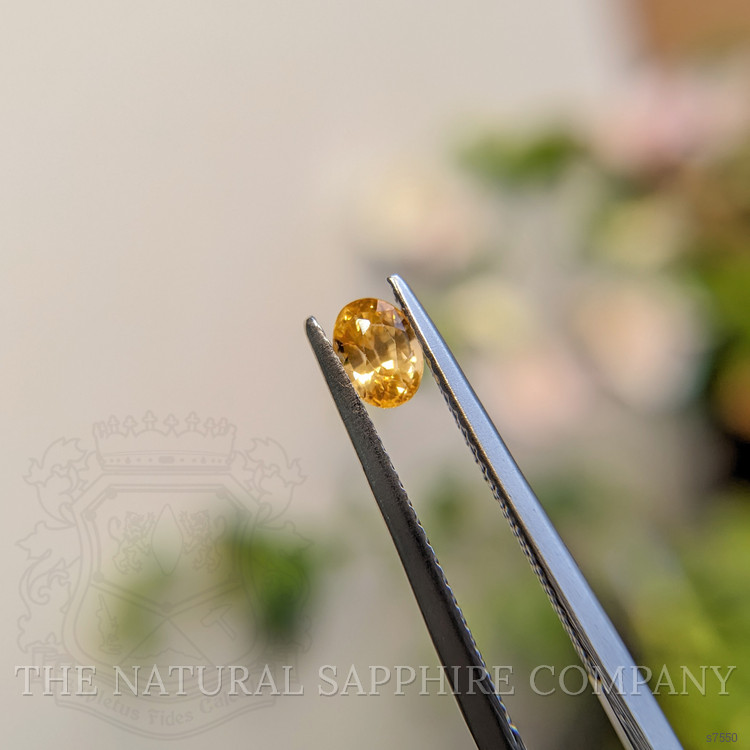 0.58 Ct. Orangish Yellow Sapphire from Madagascar