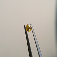 0.41 Ct. Orangish Yellow Sapphire from Madagascar Life Style