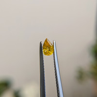 0.36 Ct. Orangish Yellow Sapphire from Madagascar Life Style