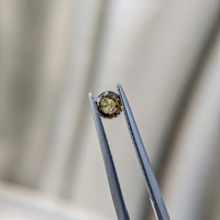 0.41 Ct. Greenish Brown Sapphire from Madagascar Life Style