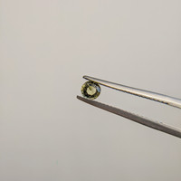 0.49 Ct. Greenish Yellow Sapphire from Madagascar Life Style
