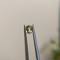 0.46 Ct. Yellowish Green Sapphire from Madagascar Life Style