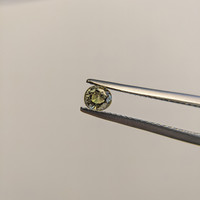 0.43 Ct. Greenish Brown Sapphire from Madagascar Life Style