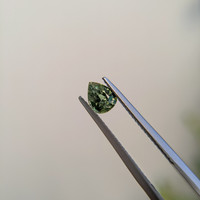 0.77 Ct. Green Sapphire from Madagascar Life Style