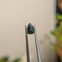 0.98 Ct. Bluish Green Sapphire from Madagascar Life Style