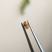 0.34 Ct. Yellowish Orange Sapphire from Madagascar Life Style
