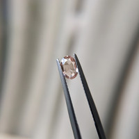 0.62 Ct. Peach Sapphire from Madagascar Life Style