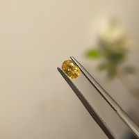 0.57 Ct. Orangish Yellow Sapphire from Madagascar Life Style