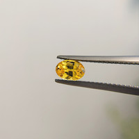 0.79 Ct. Orangish Yellow Sapphire from Madagascar Life Style