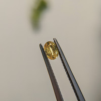 0.44 Ct. Orangish Yellow Sapphire from Madagascar Life Style