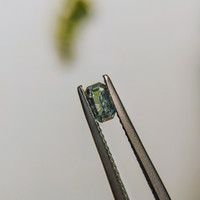0.38 Ct. Bluish Green Sapphire from Madagascar Life Style