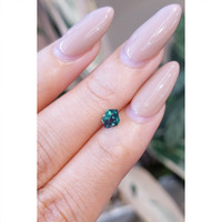 0.64 Ct. Greenish Blue Sapphire from Madagascar Life Style