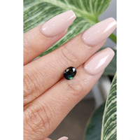 0.95 Ct. Bluish Green Sapphire from Madagascar Life Style