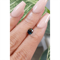 0.77 Ct. Bluish Green Sapphire from Madagascar Life Style