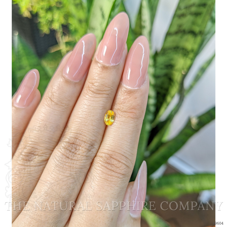 0.51 Ct. Orangish Yellow Sapphire from Ceylon (Sri Lanka)