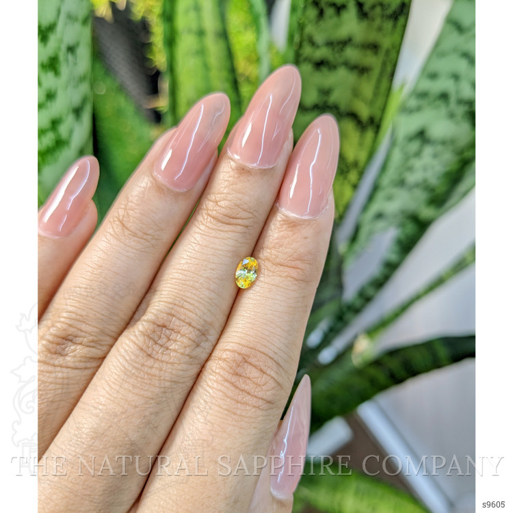 0.56 Ct. Orangish Yellow Sapphire from Ceylon (Sri Lanka)