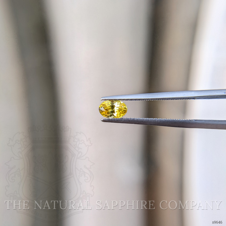 0.59 Ct. Orangish Yellow Sapphire from Ceylon (Sri Lanka)