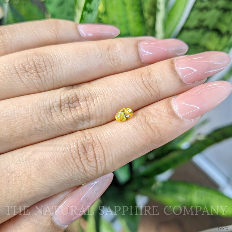 0.63 Ct. Orangish Yellow Sapphire from Ceylon (Sri Lanka)